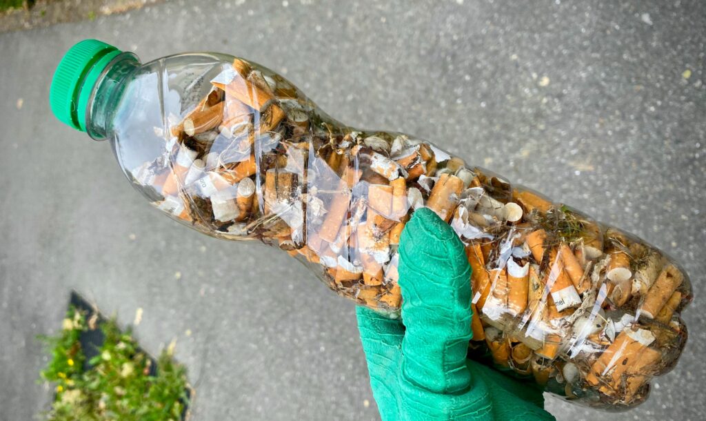 picking up cigarette butts